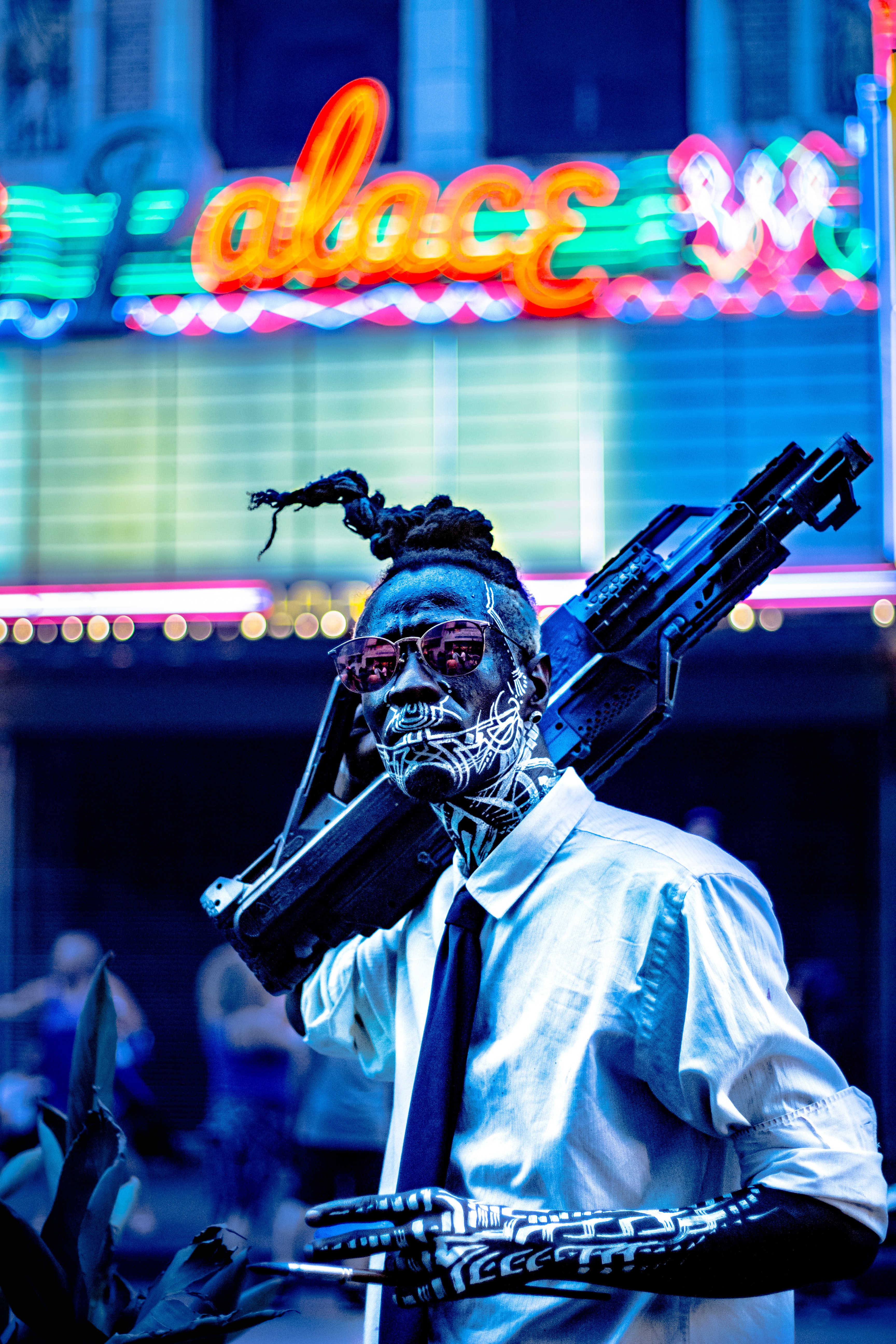 cyberpunk man, face paint neon white, holding gun, wearing sunglasses