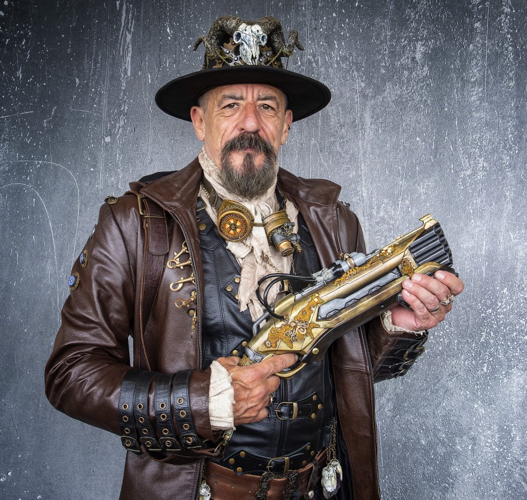 steampunk middle-aged man with gun and waistcoat